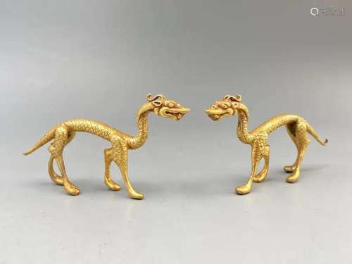 A PAIR OF GLIT SILVER DRAGON EFFIGIES