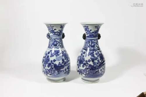 A PAIR OF BLUE AND WHITE 'BIRD AND FLOWER' VASES