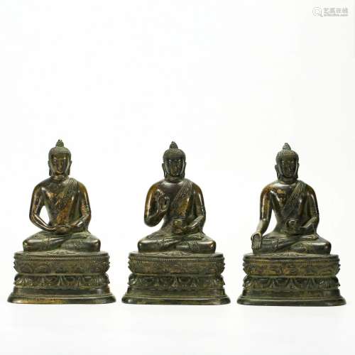 A Set of Three Bronze Seated Realms