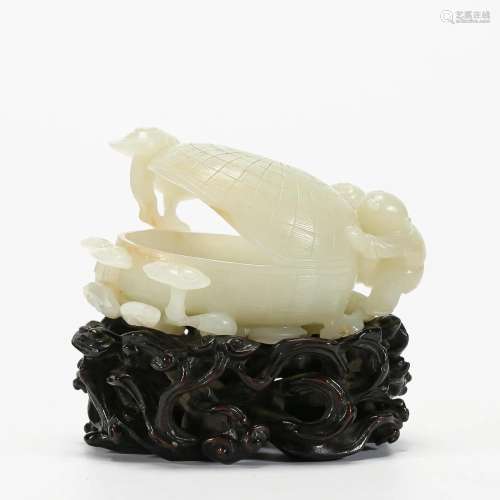 A Carved White Jade Decoration with Stand