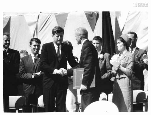 President Kennedy honours John Glenn after his historic orbi...