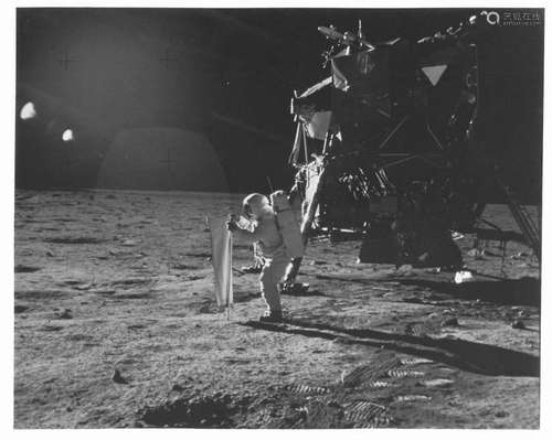 The first photograph of a human standing on the Moon, Apollo...