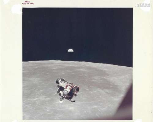 Lunar Module station-keeping with Earthrise above it, Apollo...