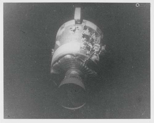 View of the damaged Service Module after jettison (black and...