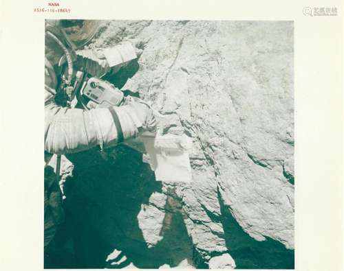 Charles Duke collects samples at Outhouse Rock, EVA 3, Apoll...