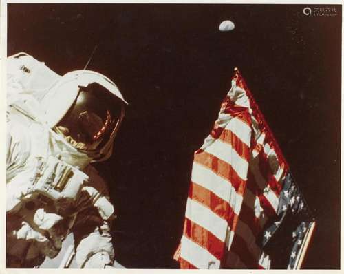 Portrait of Harrison Schmitt with the Earth above the deploy...