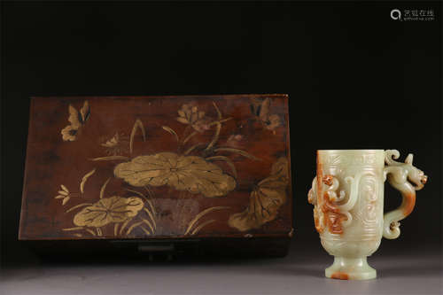 A Hetian Jade Cup with Dragon Design.