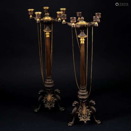 A pair of french patinated and gilded bronze five lights fla...