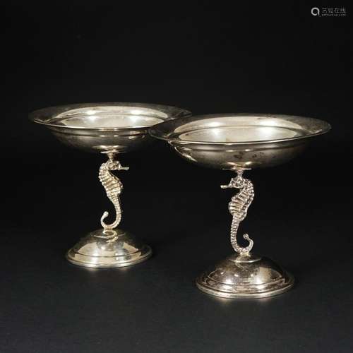 A pair of sterling silver small stands