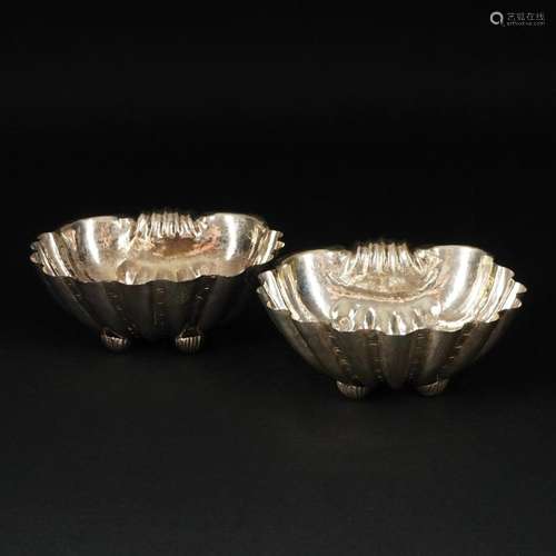 A pair of antique silver shell bowls