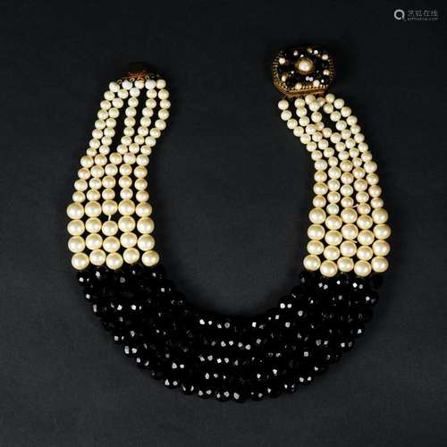 A five strand of black glass spheres and fake pearls necklac...