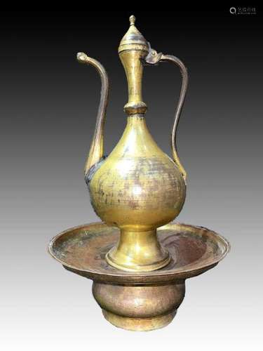 An Ottoman gilt-copper (tombak) lidded ewer and basin, Turke...