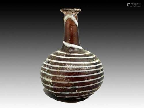 ISLAMIC SWIRL GLASS BOTTLE, 12TH CENTURY