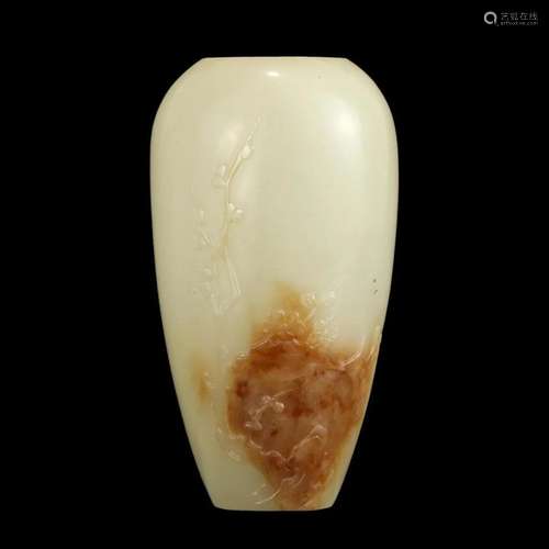 A CARVED WHITE JADE 'PRUNUS' VASE