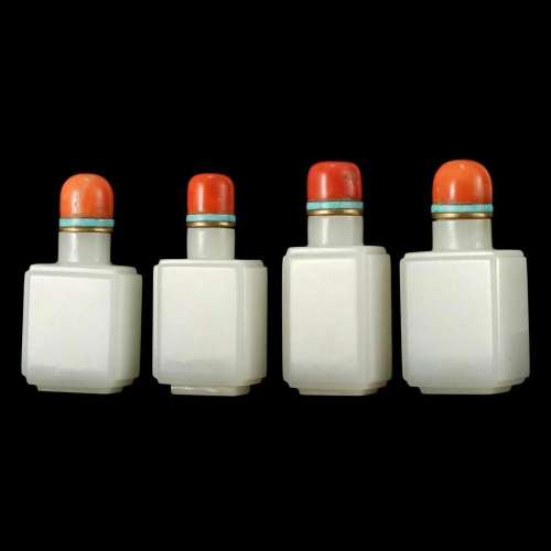 A GROUP OF FOUR SQUARED WHITE JADE SNUFF BOTTLES