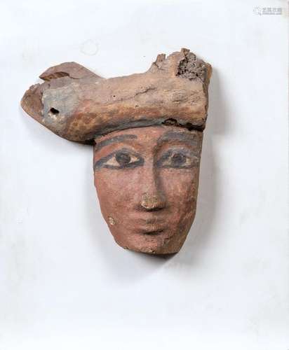 A Fragment of an Egyptian sarcophagus mask.