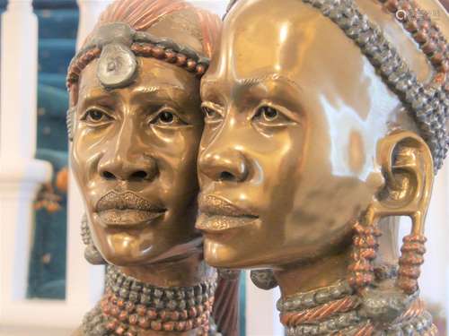 An African Bronze of a female head. Gilt bronze patination.