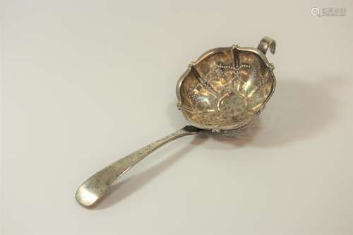 An Antique Silver Coloured Metal Tea strainer. Apparently un...