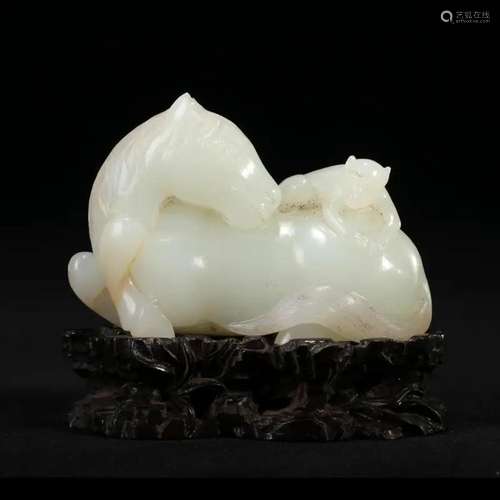 A WHITE JADE 'HORSE' CARVING