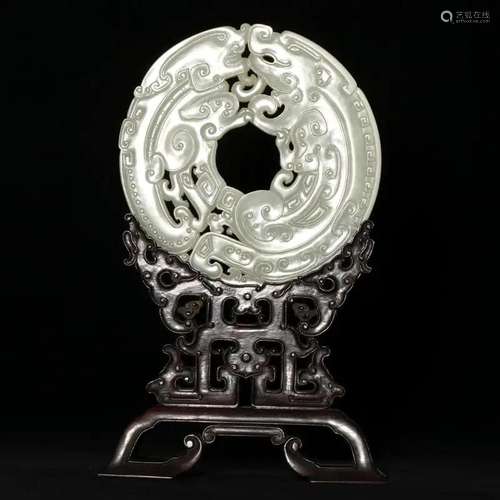 AN ARCHAISTIC WHITE JADE DISC