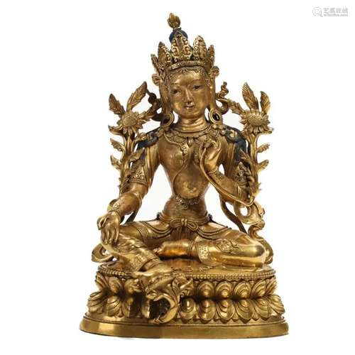 A GILT-BRONZE FIGURE OF SEATED TARA