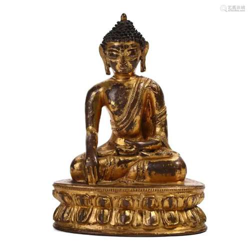 A GILT-BRONZE FIGURE OF SHAKYAMUNI, TIBET