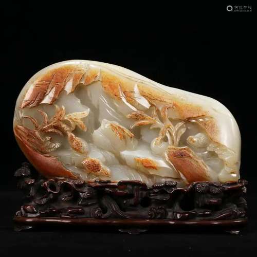 A WHITE AND RUSSET JADE BOULDER