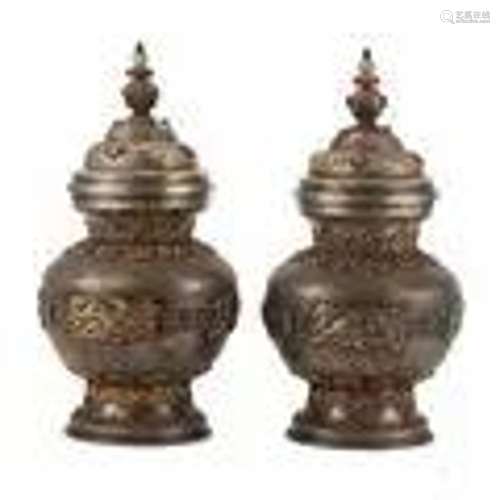 A PAIR OF SILVER VASES