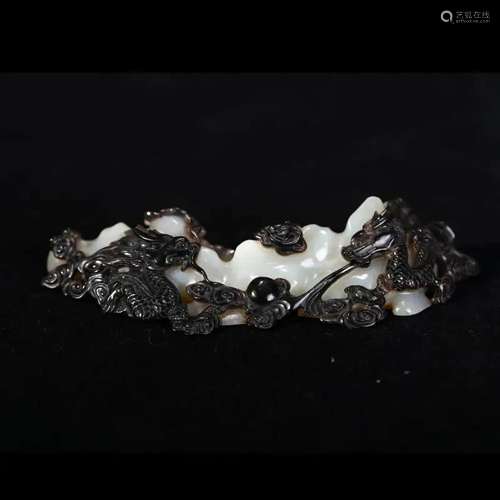 A BLACK AND WHITE JADE 'DRAGON' BRUSH REST, CHINA