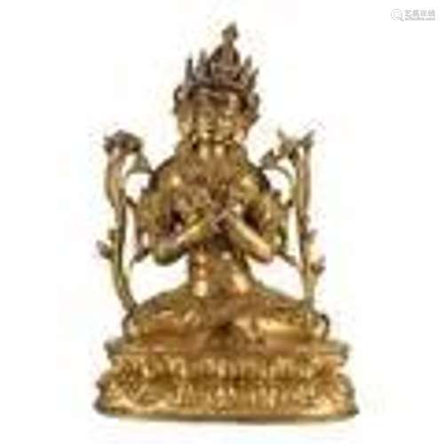 A GILT-BRONZE FIGURE OF SEATED TARA