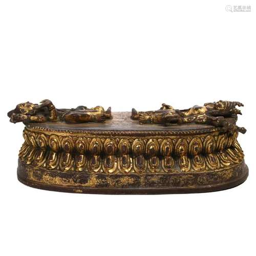 A GILT-BRONZE BASE, TIBET