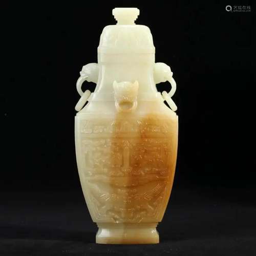 A WHITE JADE VASE WITH LOOPED HANDLES