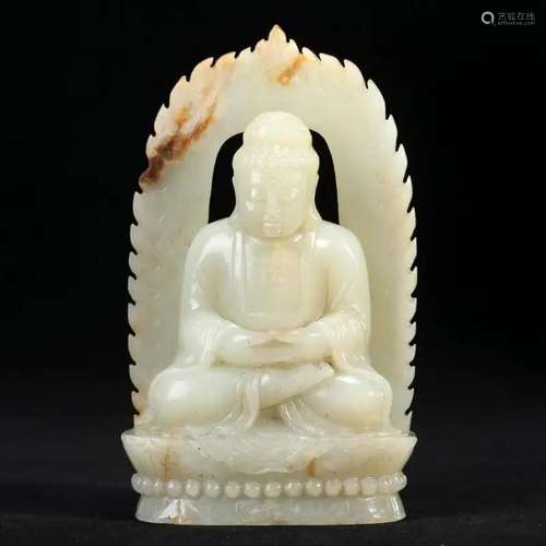 A WHITE JADE FIGURE OF SEATED SHAKYAMUNI