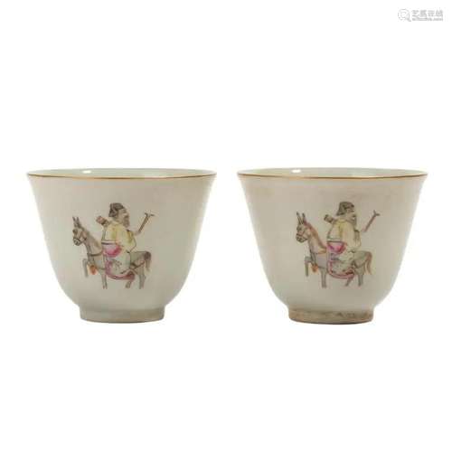 A PAIR OF WHITE-GLAZED 'FIGURES' CUPS