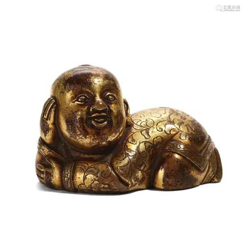 A GILT-BRONZE 'BOY' CARVING