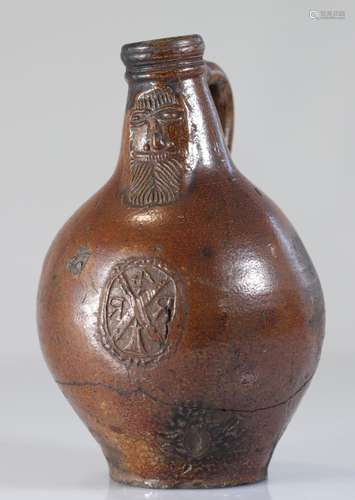 Raeren stoneware jug decorated with a bearded man 16th