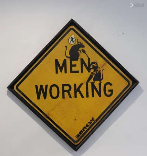 Banksy. “Men Working”. Black spray on yellow road sign.