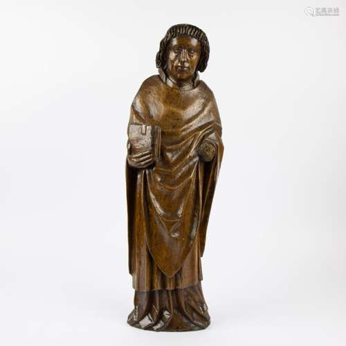 Wooden statue of a evangelist with book 16th century