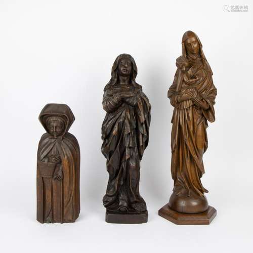 A collection of of 3 wooden Saints statues