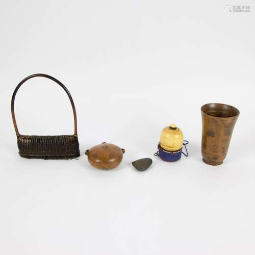 A collection including a wooden cup, a pendantmade out of ho...