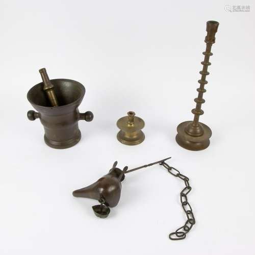 A collection of bronze items a.o. a 7 button candlestick, mo...