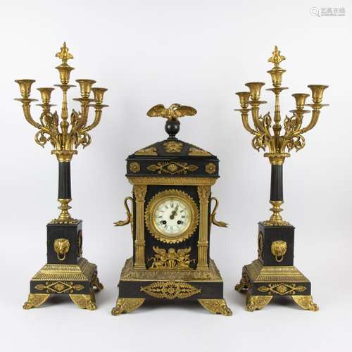 A three-piece Napoleon III clock garniture in black marble a...