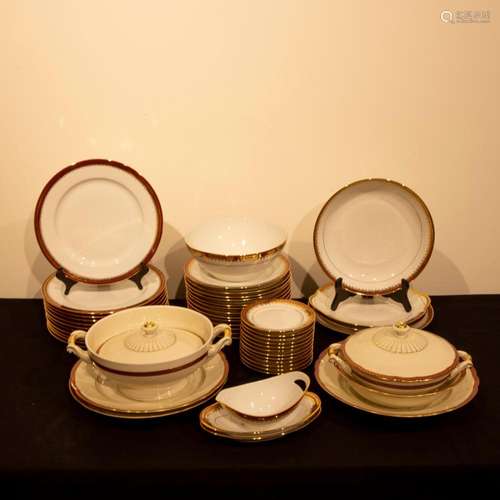 Gold and red trimmed porcelain Limoges tableware