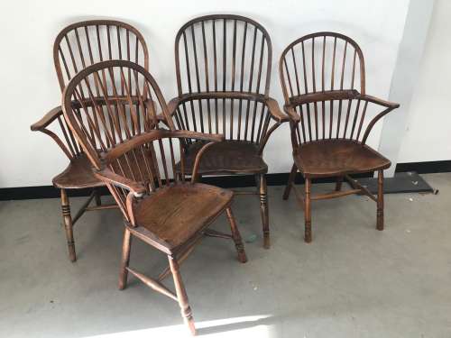 A group of antique and vintage Windsor style chairs, some wi...