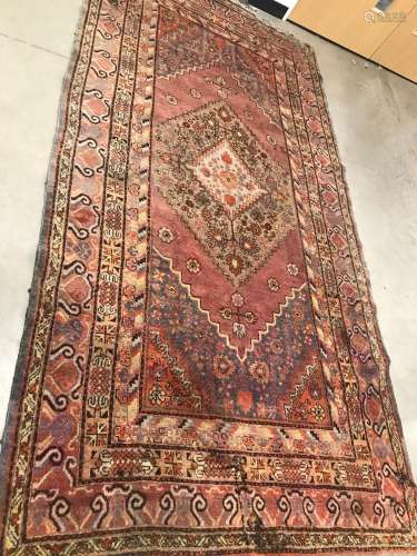 A vintage Middle Eastern woollen carpet, 340cm by 170cm, in ...