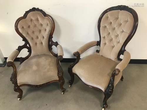 Two Victorian carved walnut spoon back armchairs