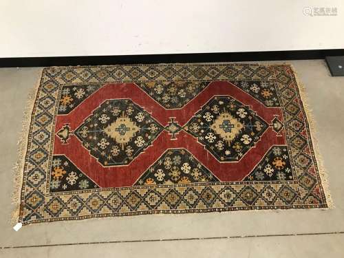 An early 20th century Middle Eastern woollen carpet, AF, 175...