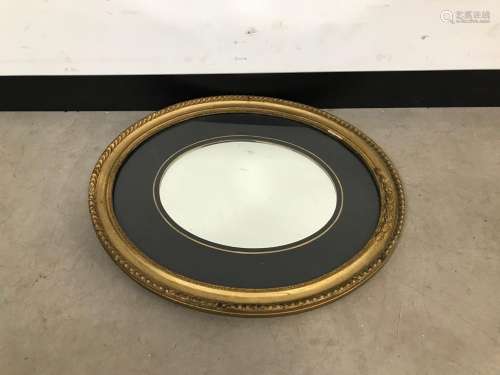 A Victorian oval gilt mirror, 58cm high
