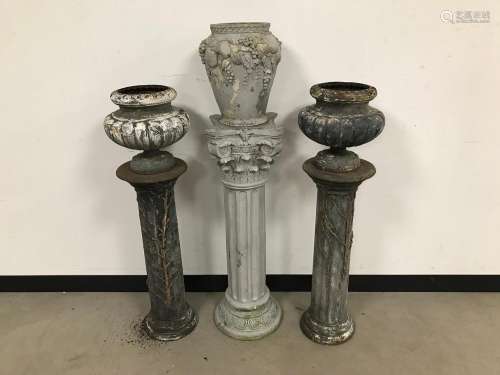 A pair of vintage cast iron pillars with flower pots, AF, 10...