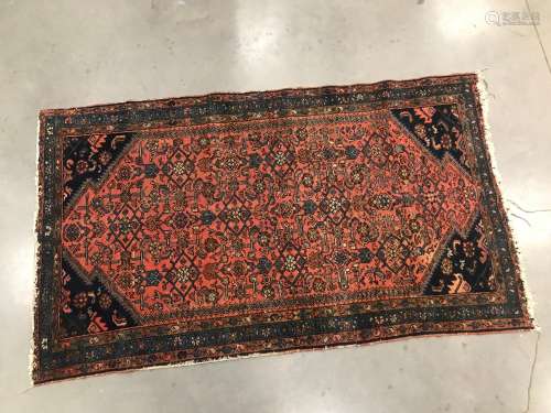 A 20th century Middle Eastern carpet, with geometric pattern...